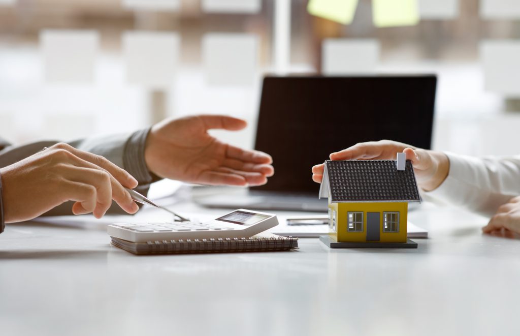 The real estate agent explains the business contract, rent, purchase, mortgage, loan, or home insurance buyer concept.
