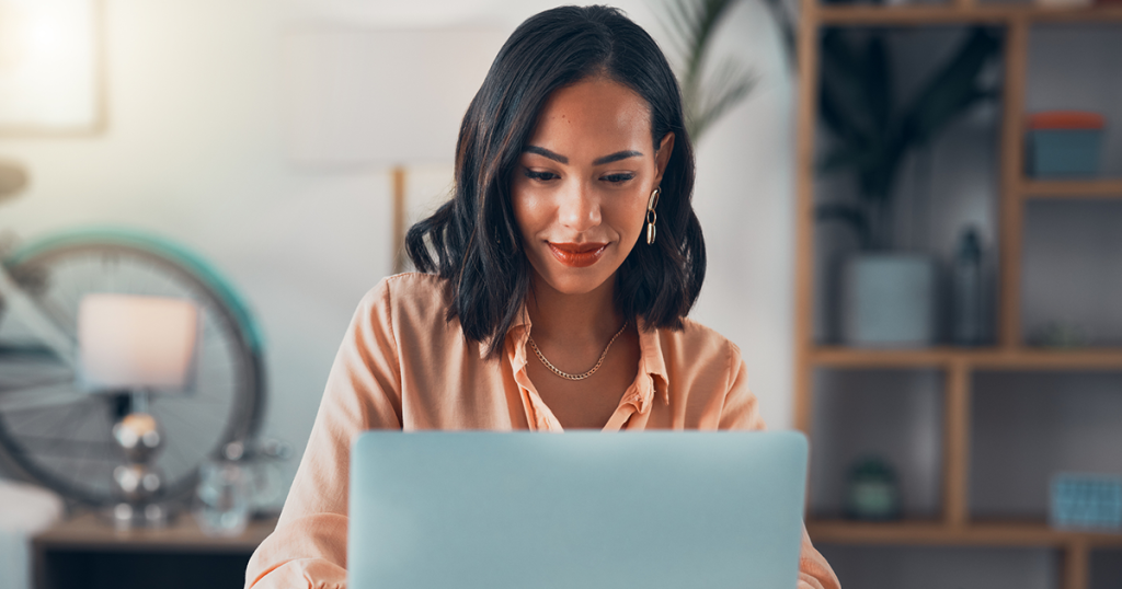 Woman looking at laptop computer.